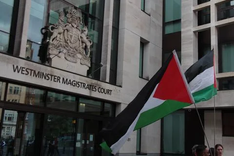 Palestine Action protest flags at Westminster Court Stock Photos