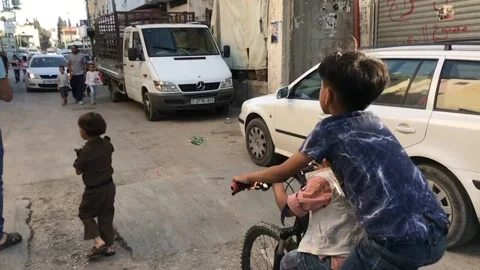 Palestinian children walk Stock Footage 156358385