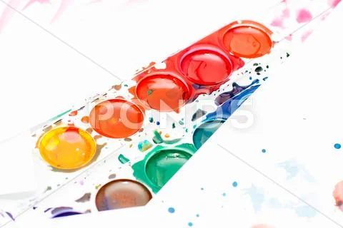 Palette of children's watercolor paint on white Stock Image #59181821