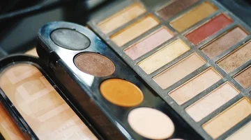 A palette with eye shadows and a makeup brush Stock Footage 86098799