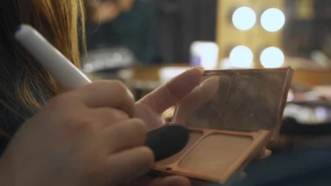 A palette with eye shadows and a makeup brush: women's cosmetics. Morning make Video stock 101021640