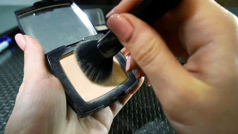 Palette with powder and makeup brushes, women's cosmetics. 動画素材 112608439