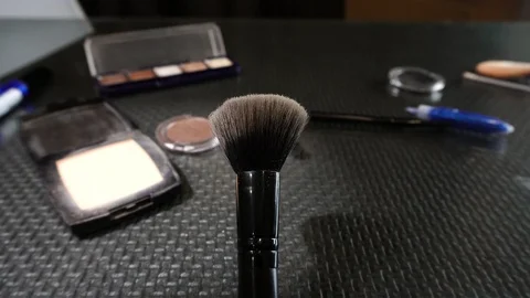 Palette with powder and makeup brushes, women's cosmetics. 動画素材 112608466