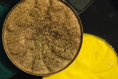 Palette of shadows for make-up with sequins and glitter. Gold, brown colours Stock Photos