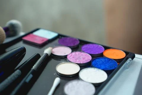 Palette of shadows for makeup on a blurred background, closeup Fotos Stock