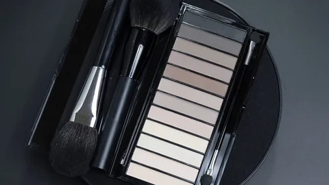 The palette of shadows rotates. Palette of eyeshadows close-up. Stock Footage 129697029