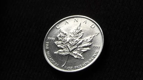 Palladium Coin shining in Changing Light - Rare Earth Metal Bullion Stock Footage 171544192