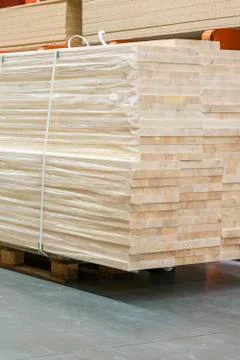 Pallet with boards in the hardware store. Packed boards in the building store Stock Photos