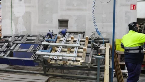 Pallet manufacturing process in slow motion, worker assembling wooden pallets Stock-Footage 313917994