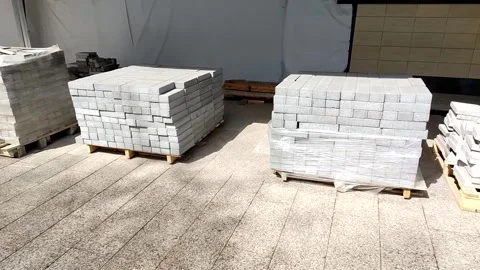 Pallet with paving slabs at a construction site. Construction materials ready fo Stock Footage 311154590