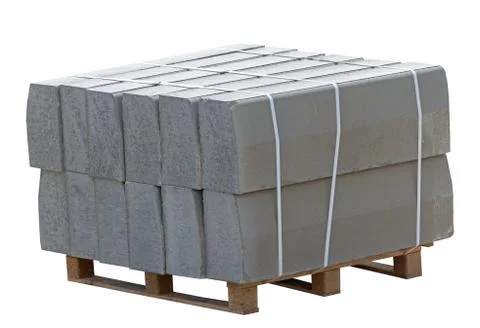 Pallet with a stack of concrete curbstone Stock Photos