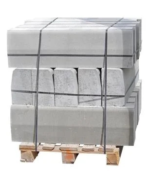 The pallet with a stack of concrete curbstone on white Stock Photos