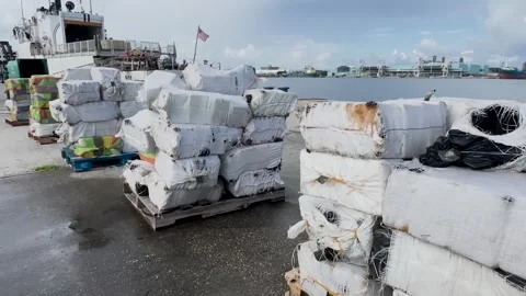Pallets of bales of seized narcotics onboard USGC Cutter Forward Stock Footage 280107929