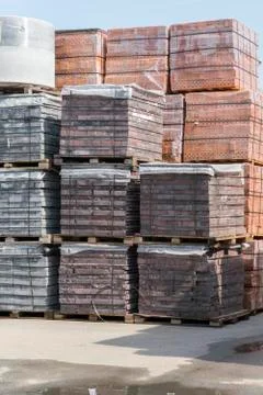 Pallets with bricks in the building store. Racks with brick. Masonry, stonewo Stock Photos