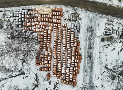 Pallets of bricks for construction. Outdoor storage in winter Stock Photos