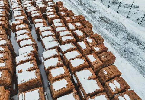 Pallets of bricks for construction. Outdoor storage in winter Stock Photos