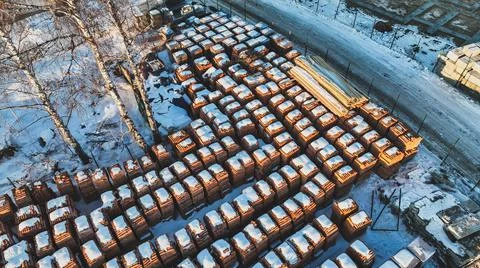Pallets of bricks for construction. Outdoor storage in winter Stock Photos