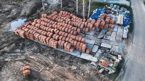 Pallets of bricks for construction. Outdoor storage Stock Photos