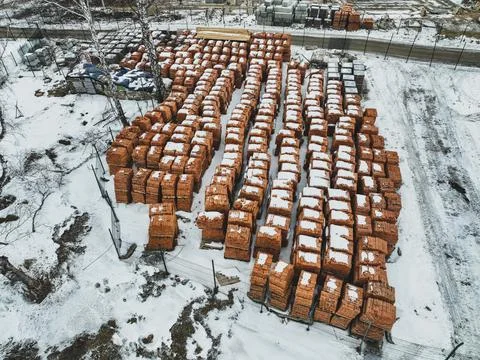 Pallets of bricks for construction. Outdoor storage in winter Stock Photos
