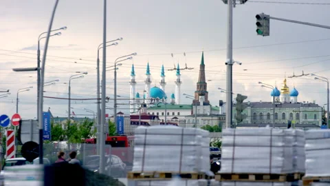 Pallets with building material against city landscape Stock Footage 244635380