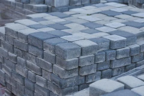 Pallets with folded paving slabs grey color Stock Photos