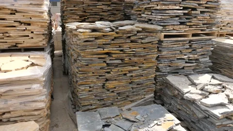 Pallets with stack of natural stone blocks lying at warehouse of building Stock Footage 156356677
