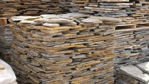 Pallets with stack of natural stone blocks lying at warehouse of building Stock Footage 167813641