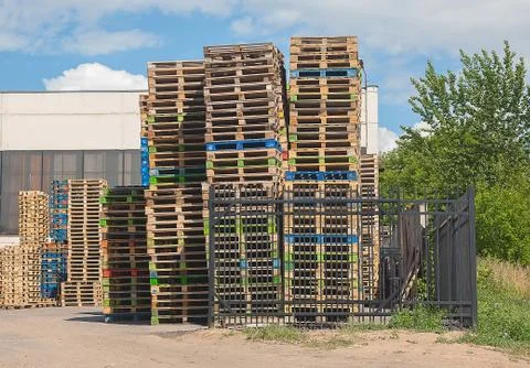 Pallets in stacks outside Stock Photos
