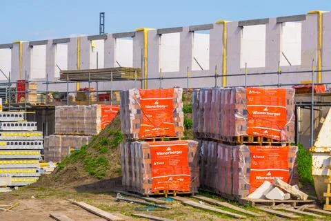 Pallets with wienerberger facing bricks on a consturction site, Building mate Stock Photos