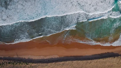 Palm Beach, Australia. Ocean waves roll on the sandy coastline, top view from Stock Footage 129396063