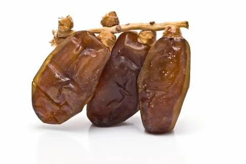 Palm branch with three dates. Stock Photos