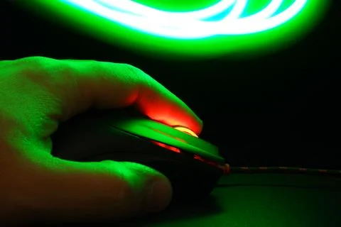 Palm on a computer mouse Foto stock