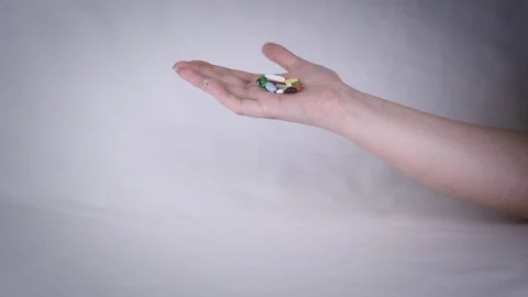 Palm covered tablets in slow motion Stock Footage 107216613