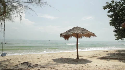 Palm Leaf Parasol Ropes Swing Rocks And Waves Break Stock Footage 43097884