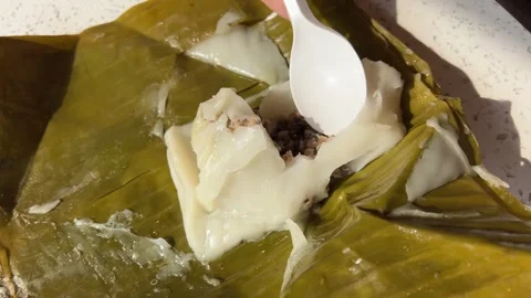 Palm Leaf Pie. Vietnamese food in palm leaf. Vietnamese street food, served in Stock Footage 301284775