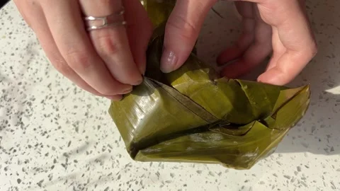 Palm Leaf Pie. Vietnamese food in palm leaf. Vietnamese street food, served in Stock Footage 301285482