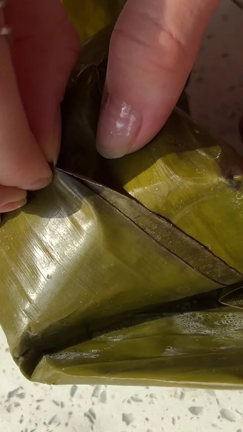 Palm Leaf Pie. Vietnamese food in palm leaf. Vietnamese street food, served in Stock Footage 303501499