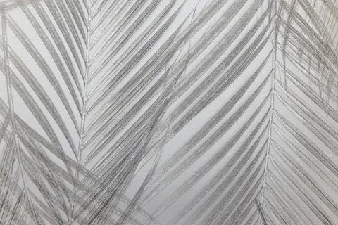 Palm leaf shadow pattern on textured wall Stock Photos