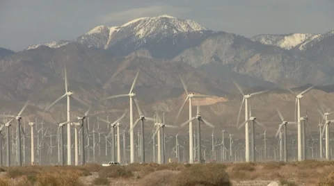 Palm Springs Wind Farm with Snow Capped Mountains Stock Footage