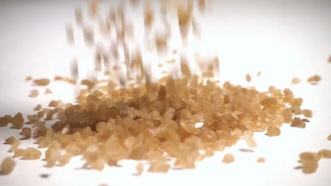 Palm sugar crystals falling in slow motion Stock Footage 76563954
