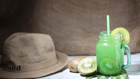 Palm takes the hat off the table with a drink Vídeo Stock 100741976