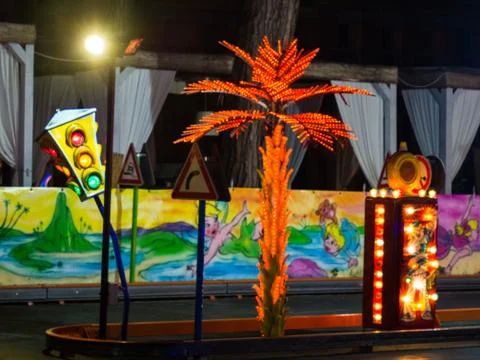 A palm tree and a traffic light Stock Photos