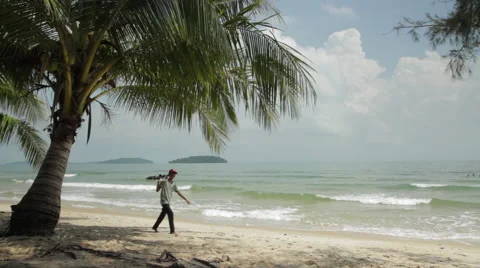 Palm Tree Sandy Beach Ocean Sunshine Man Selling Stock Footage 43080535