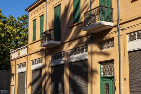Palm tree shadow on generic mediterranean architecture street house Stock Photos