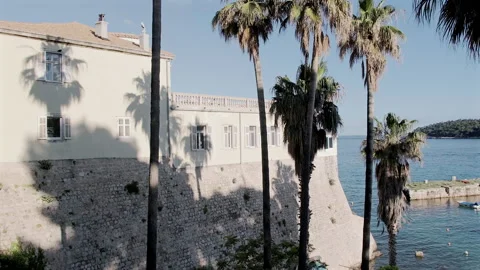 Palm tree shadows on wall of Old Town building, Dubrovnik, Croatia, 4k Video stock 274458024