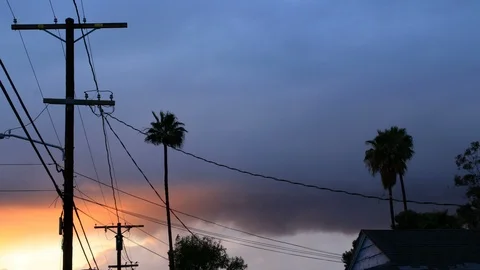 Palm trees and power lines at sunset in Los Angeles - timelapse 스톡 동영상 87754283