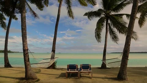 Palm trees and sunbed with hammock on the beach of exotic Carribean Islands. Stock Footage 201603218