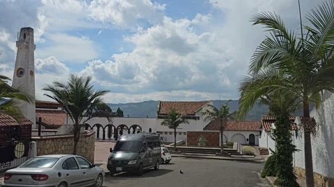 Palm Trees and White Tower in Village Street, Guatavita, Cundinamarca, Colombia Stock Footage 331521718
