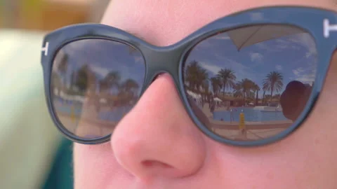 Palm trees reflection on sunglasses in slow motion 180fps Stock Footage 164550154