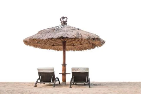 Palm trees on white sandy beach, two sunbed and parasol. View of nice tropica Stock-Fotos